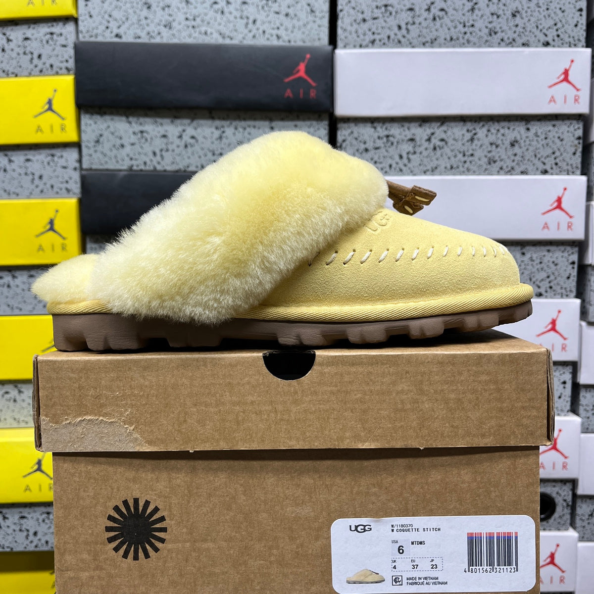 UGG Soft Yellow Slippers with Plush Collar and Stitch Detail