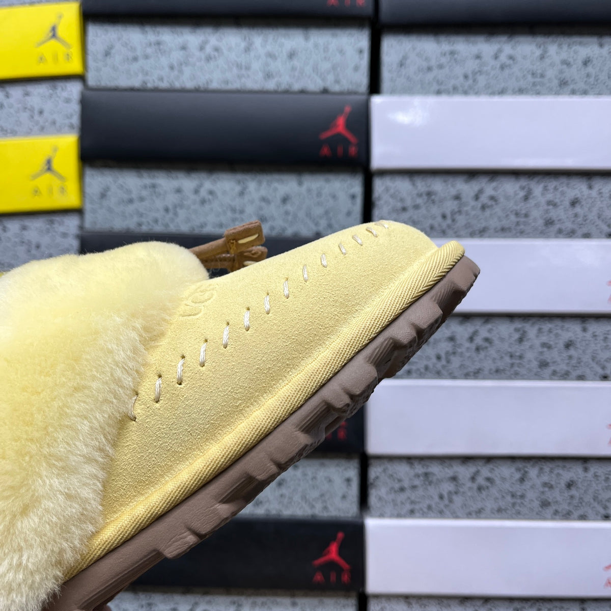 UGG Soft Yellow Slippers with Plush Collar and Stitch Detail