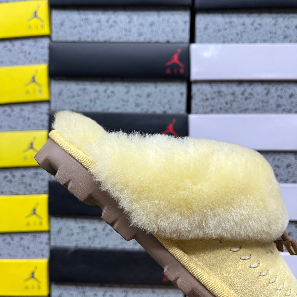 UGG Soft Yellow Slippers with Plush Collar and Stitch Detail