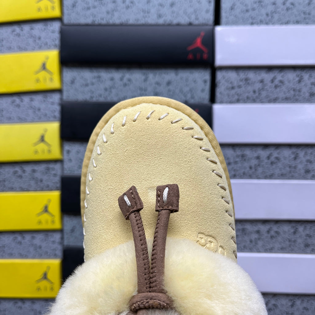UGG Soft Yellow Slippers with Plush Collar and Stitch Detail